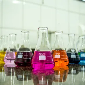 High-quality laboratory glassware and colorful chemical reagents for industrial and educational testing at Saffron Chemicals
